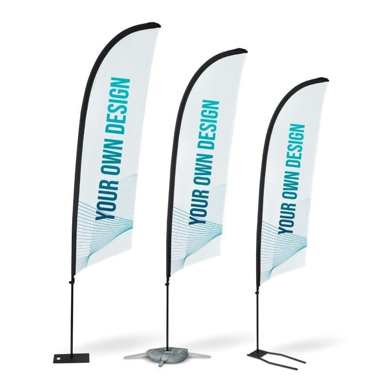 Three white vertical banners with 'Your Own Design' text in blue, standing on different bases.